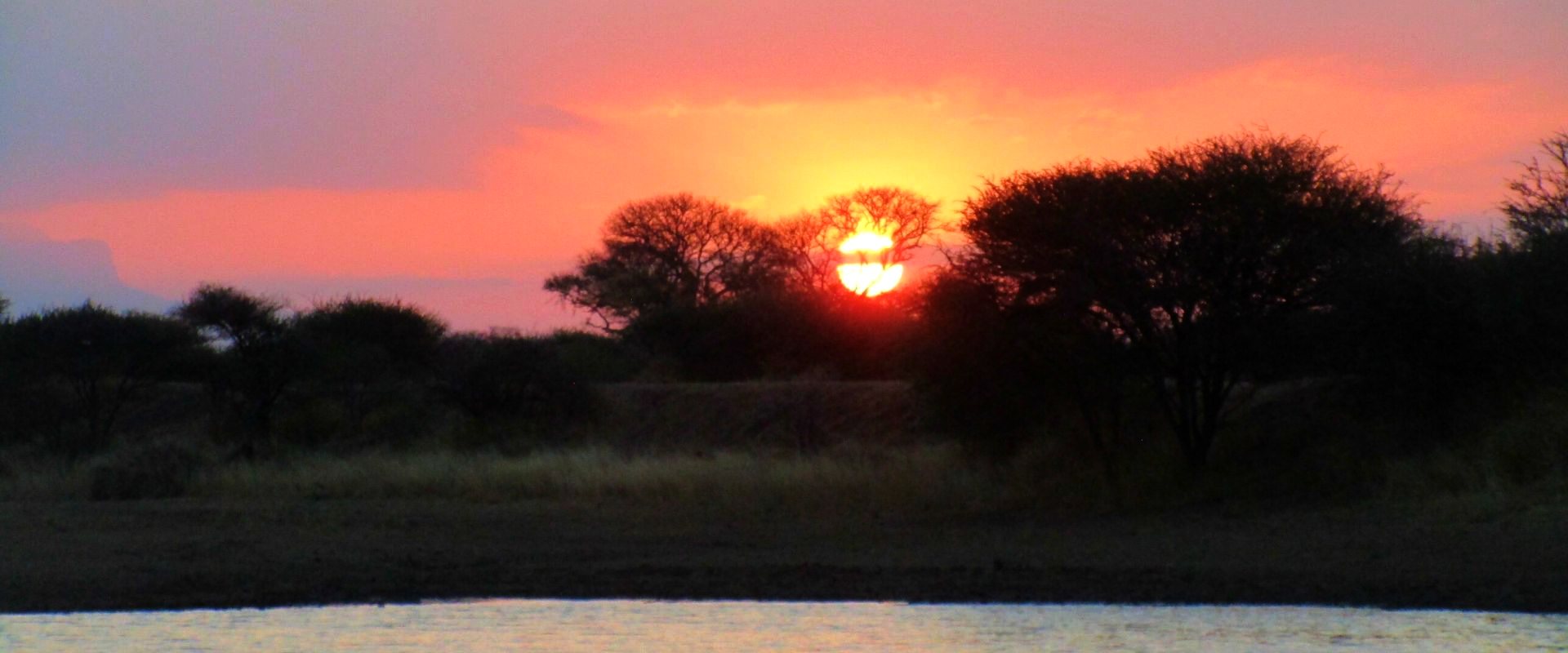 Sunset over the waterhole at Zulani Safaris, Limpopo